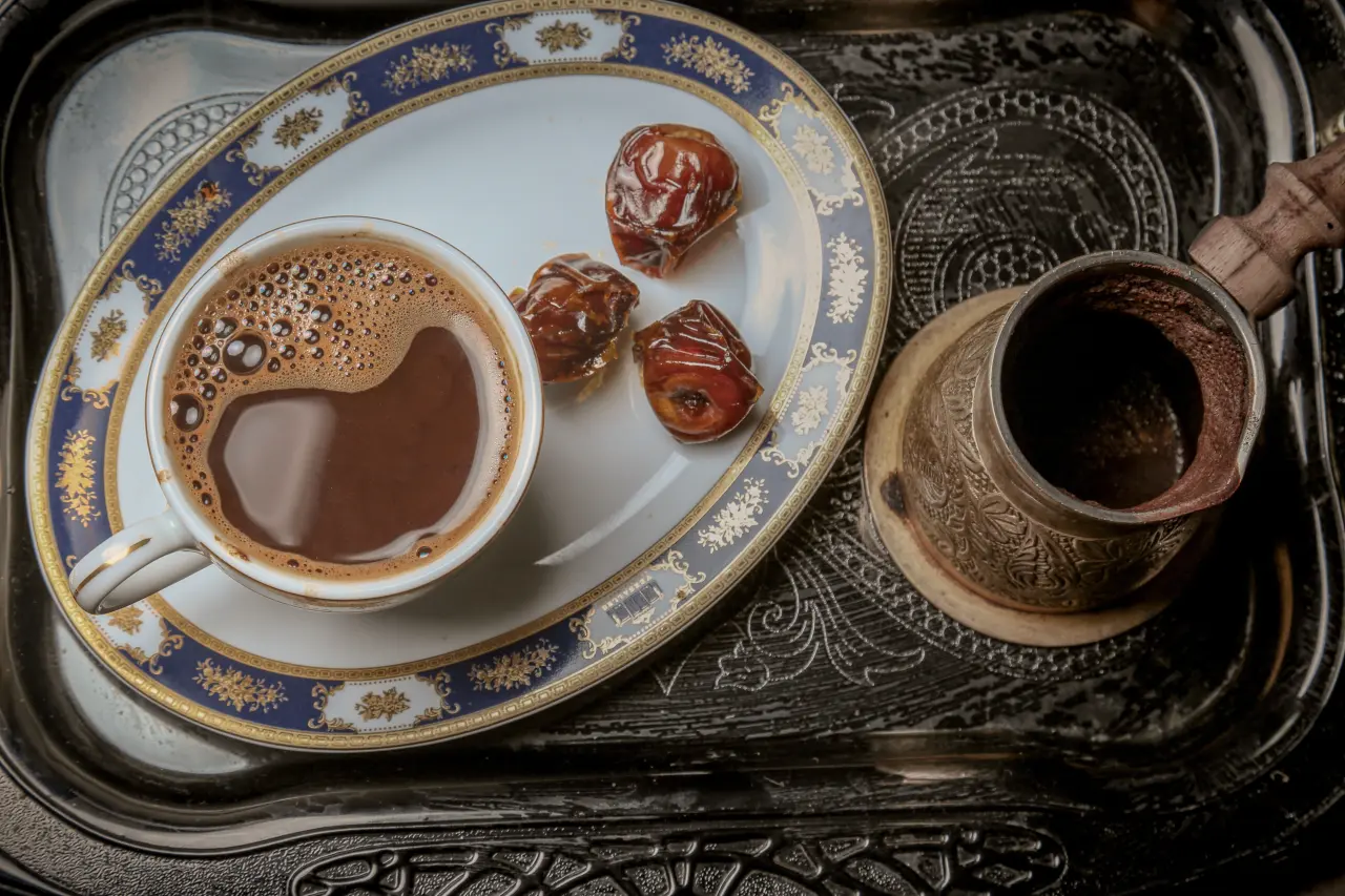cup-of-coffee-with-dates-on-a-serving-tray-3652513